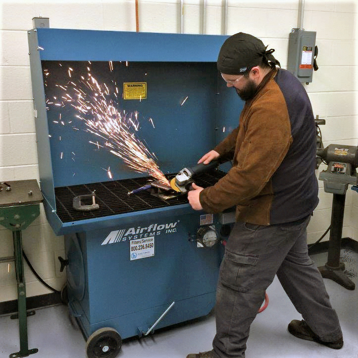 Welding in portable downdraft booth